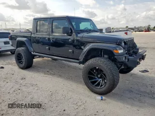 2021 Jeep Gladiator Freedom with VIN 1C6HJTAG8ML580882, listed as a Copart auction lot 57690885 with Not provided miles and Salvage title. Bid and sale history available at DreamBid. Image 4.