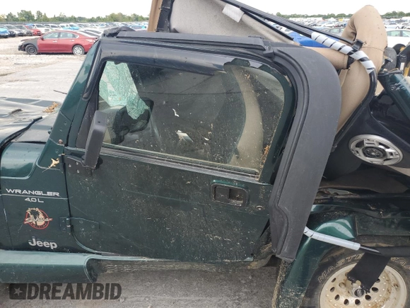 2000 Jeep Wrangler Sahara with VIN 1J4FA59SXYP785570, listed as a Copart auction lot 57659664 with 0 mi miles and Salvage Title. Bid and sale history available at carsss.com. Image 7.