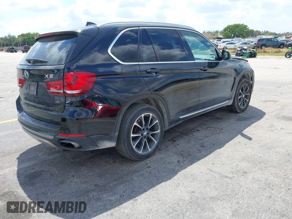 2016 BMW X5 xDrive50i with VIN 5UXKR6C51G0J81658, listed as a IAAI auction lot 41801382 with 34,572 mi miles. Bid and sale history available at carsss.com. Image 4.