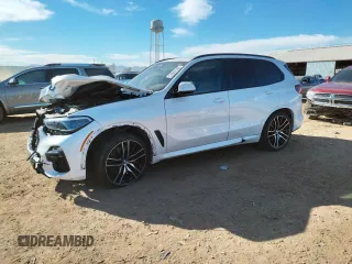 2020 BMW X5 M50i with VIN 5UXJU4C00L9B77869, listed as a Copart auction lot 36123043 with 27,195 mi miles. Bid and sale history available at carsss.com. Image 1.