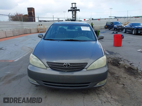 2004 Toyota Camry LE with VIN 4T1BF32K84U588764, listed as a IAAI auction lot 42126345 with 144,642 mi miles. Bid and sale history available at carsss.com. Image 12.