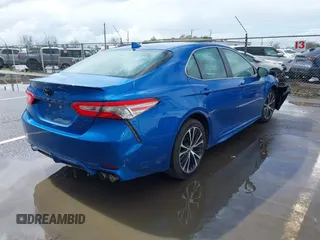 2019 Toyota Camry LE z VIN 4T1B11HK1KU282870, wystawiony jako IAAI lot #41799625 z przebiegiem 63 977 mil mil oraz . Historia ofert i sprzedaży dostępna na DreamBid. Obrazek 4.