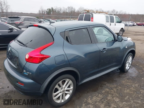 2013 Nissan Juke S with VIN JN8AF5MV7DT209881, listed as a IAAI auction lot 41728623 with 185,296 mi miles and . Bid and sale history available at DreamBid. Image 4.
