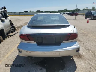 2001 Pontiac Sunfire SE z VIN 1G2JB124817315601, wystawiony jako Copart lot #63543704 z przebiegiem 147 535 mil mil oraz Szkody całkowita. Historia ofert i sprzedaży dostępna na DreamBid. Obrazek 6.