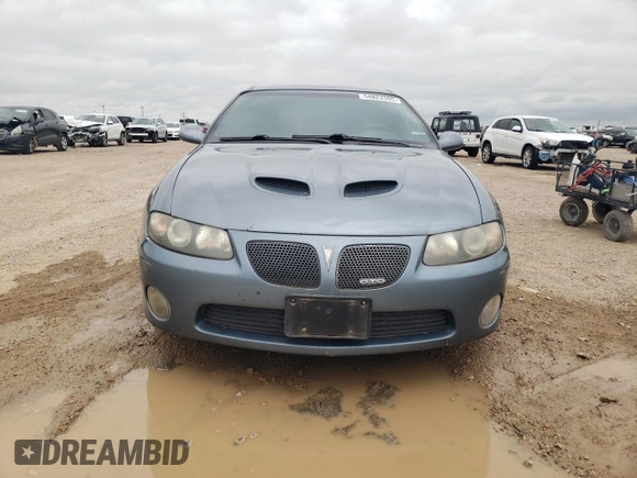 2006 Pontiac GTO z VIN 6G2VX12U06L550451, wystawiony jako Copart lot #54823105 z przebiegiem 273 049 mil mil oraz Tytuł czysty. Historia ofert i sprzedaży dostępna na DreamBid. Obrazek 5.