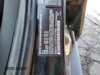 2015 BMW X1 xDrive28i with VIN WBAVL1C5XFVY31850, listed as a Copart auction lot 77491614 with 112,442 mi miles and Clean Title. Bid and sale history available at carsss.com. Image 13.