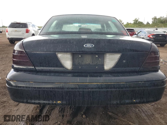 2004 Ford Police Interceptor with VIN 2FAHP71W14X138220, listed as a Copart auction lot 59930385 with 169,302 mi miles and Salvage title. Bid and sale history available at DreamBid. Image 6.