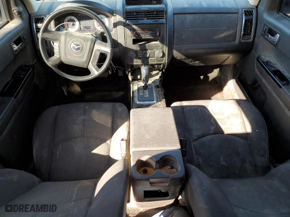 2010 Mazda Tribute Sport with VIN 4F2CY9C7XAKM03394, listed as a Copart auction lot 47975075 with 145,286 mi miles and Salvage Title. Bid and sale history available at carsss.com. Image 8.