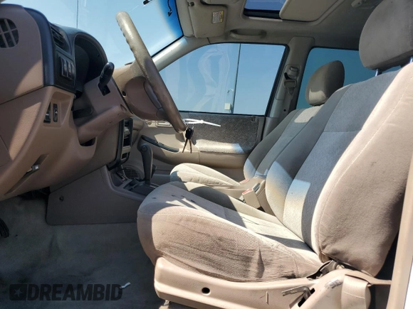 2000 Isuzu Rodeo S with VIN 4S2DM58WXY4302769, listed as a Copart auction lot 70416054 with 150,621 mi miles and Salvage Title. Bid and sale history available at DreamBid. Image 7.