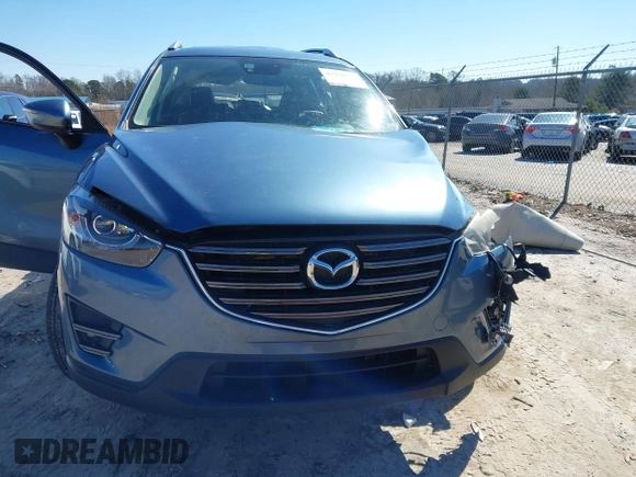 2016 Mazda CX-5 Grand Touring with VIN JM3KE2DY2G0715272, listed as a IAAI auction lot 41590492 with 134,176 mi miles. Bid and sale history available at carsss.com. Image 13.