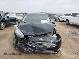 2019 Ford Fiesta SE z VIN 3FADP4BJ7KM158142, wystawiony jako IAAI lot #41510806 z przebiegiem 55 315 mil mil oraz . Historia ofert i sprzedaży dostępna na DreamBid. Obrazek 12.