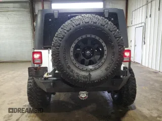 2014 Jeep Wrangler Unlimited Sport with VIN 1C4BJWDG4EL125251, listed as a Copart auction lot 51092675 with 76,867 mi miles and Clean Title. Bid and sale history available at carsss.com. Image 6.