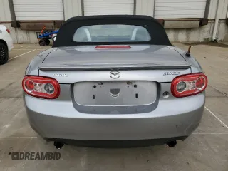 2009 Mazda MX-5 Miata Grand Touring z VIN JM1NC25F090202047, wystawiony jako Copart lot #55810505 z przebiegiem 91 618 mil mil oraz Szkody całkowita. Historia ofert i sprzedaży dostępna na DreamBid. Obrazek 6.