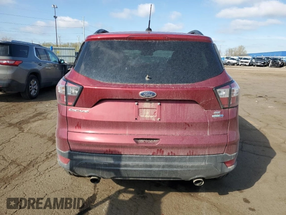 2018 Ford Escape SE z VIN 1FMCU9GD0JUC29279, wystawiony jako Copart lot #54511595 z przebiegiem 77 547 mil mil oraz Czysty tytuł • Clean title. Historia ofert i sprzedaży dostępna na DreamBid. Obrazek 6.