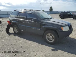 1999 Jeep Grand Cherokee Limited with VIN 1J4GW68N4XC679841, listed as a Copart auction lot 59760015 with 155,366 mi miles and Salvage title. Bid and sale history available at DreamBid. Image 4.