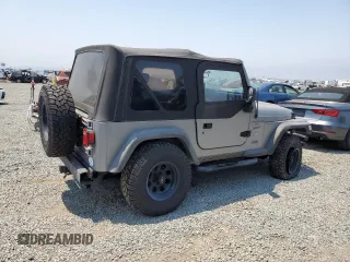 2001 Jeep Wrangler Sport с VIN 1J4FA49S41P353878, выставлен на аукционе Copart как лот 64637385 с пробегом 166 642 миль миль и Списание • Salvage title. История ставок и продаж доступна на DreamBid. Изображение 3.