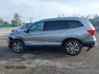 2016 Honda Pilot Touring with VIN 5FNYF6H90GB024902, listed as a IAAI auction lot 41948563 with 148,598 mi miles. Bid and sale history available at carsss.com. Image 14.