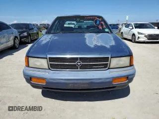 1993 Dodge Spirit z VIN 1B3XA46K0PF638477, wystawiony jako Copart lot #75710534 z przebiegiem 50 637 mil mil oraz Szkody całkowita. Historia ofert i sprzedaży dostępna na DreamBid. Obrazek 5.