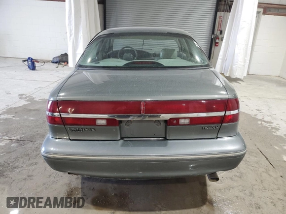1997 Lincoln Continental with VIN 1LNLM97VXVY624609, listed as a Copart auction lot 73921634 with 119,746 mi miles and Salvage Title. Bid and sale history available at carsss.com. Image 6.