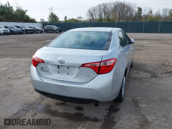 2019 Toyota Corolla L with VIN 5YFBURHE2KP934042, listed as a IAAI auction lot 41963491 with 87,299 mi miles. Bid and sale history available at carsss.com. Image 4.
