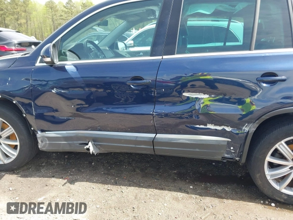 2012 Volkswagen Tiguan S with VIN WVGBV7AX3CW571039, listed as a IAAI auction lot 41928361 with 165,938 mi miles and . Bid and sale history available at DreamBid. Image 14.