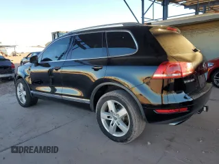 2011 Volkswagen Touareg с VIN WVGFG9BP2BD003056, выставлен на аукционе Copart как лот 84203674 с пробегом 171 456 миль миль и Списание • Salvage title. История ставок и продаж доступна на DreamBid. Изображение 2.