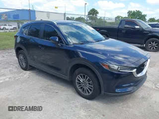 2017 Mazda CX-5 Touring with VIN JM3KFACL0H0227615, listed as a IAAI auction lot 42063618 with 72,291 mi miles. Bid and sale history available at carsss.com. Image 1.