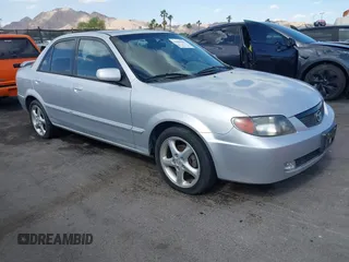 2002 Mazda Protege DX z VIN JM1BJ225020500737, wystawiony jako IAAI lot #42264063 z przebiegiem 242 308 mil mil oraz . Historia ofert i sprzedaży dostępna na DreamBid. Obrazek 1.