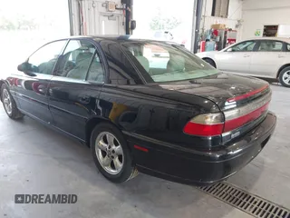 1997 Cadillac Catera z VIN W06VR54R9VR162389, wystawiony jako IAAI lot #40142990 z przebiegiem 111 558 mil mil oraz . Historia ofert i sprzedaży dostępna na DreamBid. Obrazek 3.