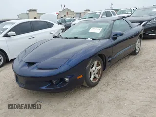 1999 Pontiac Firebird Firebird z VIN 2G2FS22K2X2232076, wystawiony jako IAAI lot #42147131 z przebiegiem 106 375 mil mil oraz . Historia ofert i sprzedaży dostępna na DreamBid. Obrazek 2.
