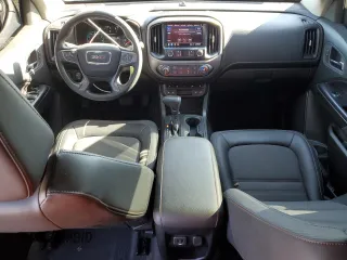 2021 GMC Canyon 4WD AT4 w/Leather with VIN 1GTG6FEN3M1274409, listed as a Copart auction lot 42502355 with 57,194 mi miles and Salvage Title. Bid and sale history available at carsss.com. Image 8.