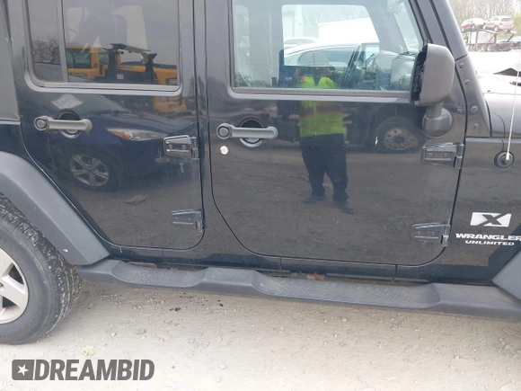 2007 Jeep Wrangler Unlimited X with VIN 1J4GA39177L153387, listed as a IAAI auction lot 42021211 with 207,965 mi miles and . Bid and sale history available at DreamBid. Image 13.