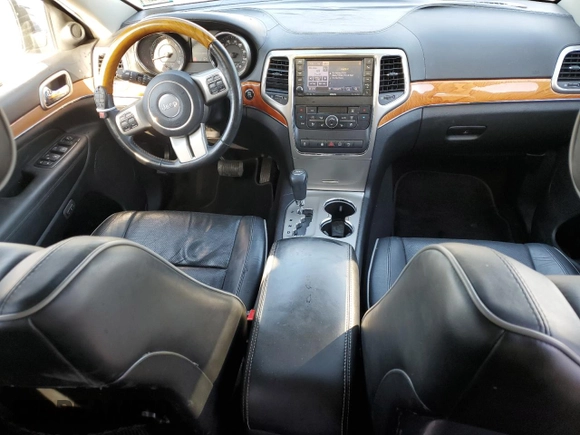 2013 Jeep Grand Cherokee Overland with VIN 1C4RJFCG2DC653207, listed as a Copart auction lot 48680885 with 276,020 mi miles and Salvage Title. Bid and sale history available at carsss.com. Image 8.