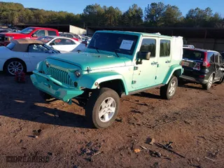2010 Jeep Wrangler Unlimited Sport with VIN 1J4BA3H15AL166397, listed as a IAAI auction lot 41391376 with 87,091 mi miles. Bid and sale history available at carsss.com. Image 2.