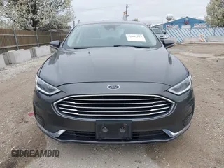 2019 Ford Fusion SEL with VIN 3FA6P0CDXKR129411, listed as a IAAI auction lot 42082323 with 126,048 mi miles and . Bid and sale history available at DreamBid. Image 12.