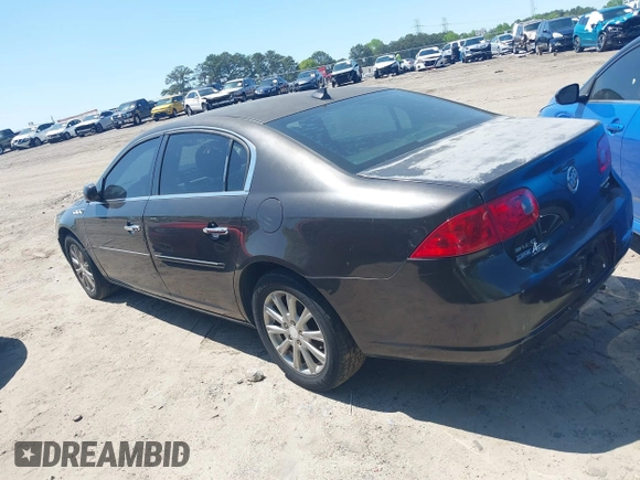 2009 Buick Lucerne CXL with VIN 1G4HD57M59U122626, listed as a IAAI auction lot 42004989 with 184,026 mi miles. Bid and sale history available at carsss.com. Image 3.