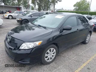2010 Toyota Corolla with VIN 1NXBU4EE1AZ285449, listed as a IAAI auction lot 42040668 with 121,404 mi miles and . Bid and sale history available at carsss.com. Image 2.