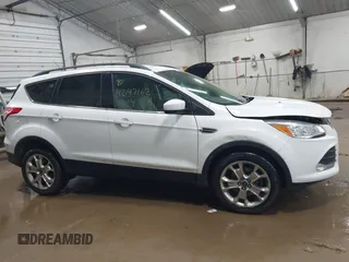 2014 Ford Escape SE with VIN 1FMCU9G99EUC15477, listed as a IAAI auction lot 42147162 with 98,886 mi miles and . Bid and sale history available at DreamBid. Image 13.