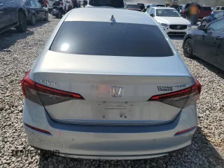 2023 Honda Civic Touring z VIN 2HGFE1F94PH310134, wystawiony jako Copart lot #52311085 z przebiegiem 32 682 mil mil oraz Szkoda całkowita • Salvage title. Historia ofert i sprzedaży dostępna na DreamBid. Obrazek 6.