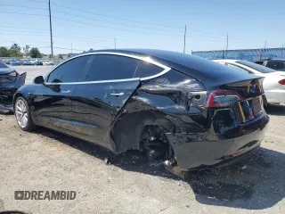 2019 Tesla Model 3 Mid Range z VIN 5YJ3E1EA9KF314143, wystawiony jako Copart lot #53564335 z przebiegiem 77 168 mil mil oraz Szkoda całkowita • Salvage title. Historia ofert i sprzedaży dostępna na DreamBid. Obrazek 2.