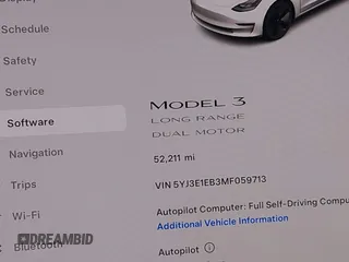 2021 Tesla Model 3 Long Range with VIN 5YJ3E1EB3MF059713, listed as a IAAI auction lot 41778289 with 52,211 mi miles. Bid and sale history available at carsss.com. Image 16.