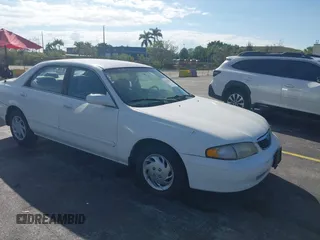 1999 Mazda 626 ES with VIN 1YVGF22C4X5841892, listed as a IAAI auction lot 41678373 with 66,981 mi miles. Bid and sale history available at carsss.com. Image 1.