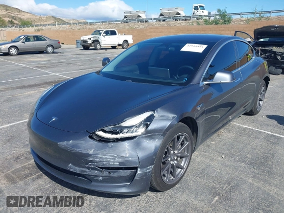 2019 Tesla Model 3 Mid Range with VIN 5YJ3E1EA6KF307456, listed as a IAAI auction lot 41944454 with 99,059 mi miles and . Bid and sale history available at DreamBid. Image 2.