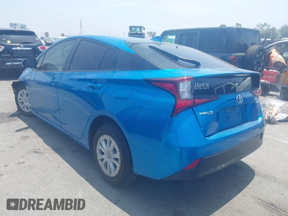 2021 Toyota Prius L Eco with VIN JTDKAMFUXM3134462, listed as a IAAI auction lot 42450931 with 89,239 mi miles and . Bid and sale history available at DreamBid. Image 3.