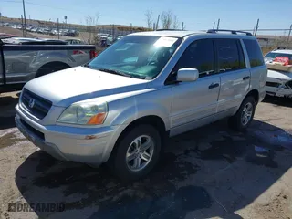 2004 Honda Pilot EX with VIN 2HKYF18674H581196, listed as a IAAI auction lot 42043003 with 220,102 mi miles. Bid and sale history available at carsss.com. Image 2.
