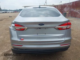 2020 Ford Fusion SE z VIN 3FA6P0LU4LR148070, wystawiony jako IAAI lot #42262446 z przebiegiem 69 057 mil mil oraz . Historia ofert i sprzedaży dostępna na DreamBid. Obrazek 16.