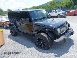2016 Jeep Wrangler Unlimited Sahara z VIN 1C4HJWEG3GL119159, wystawiony jako IAAI lot #42670734 z przebiegiem 69 366 mil mil oraz . Historia ofert i sprzedaży dostępna na DreamBid. Obrazek 1.