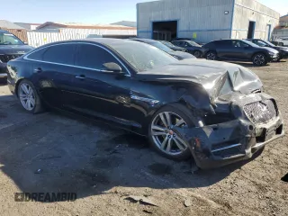 2014 Jaguar XJ with VIN SAJWA2GZXE8V59542, listed as a Copart auction lot 73672614 with 105,328 mi miles and Salvage Title. Bid and sale history available at carsss.com. Image 4.