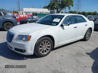 2014 Chrysler 300 with VIN 2C3CCAET6EH173381, listed as a IAAI auction lot 42158270 with 124,551 mi miles. Bid and sale history available at carsss.com. Image 2.
