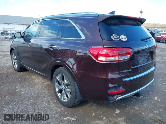 2016 Kia Sorento SX with VIN 5XYPKDA58GG002304, listed as a IAAI auction lot 41990332 with 132,025 mi miles. Bid and sale history available at carsss.com. Image 3.